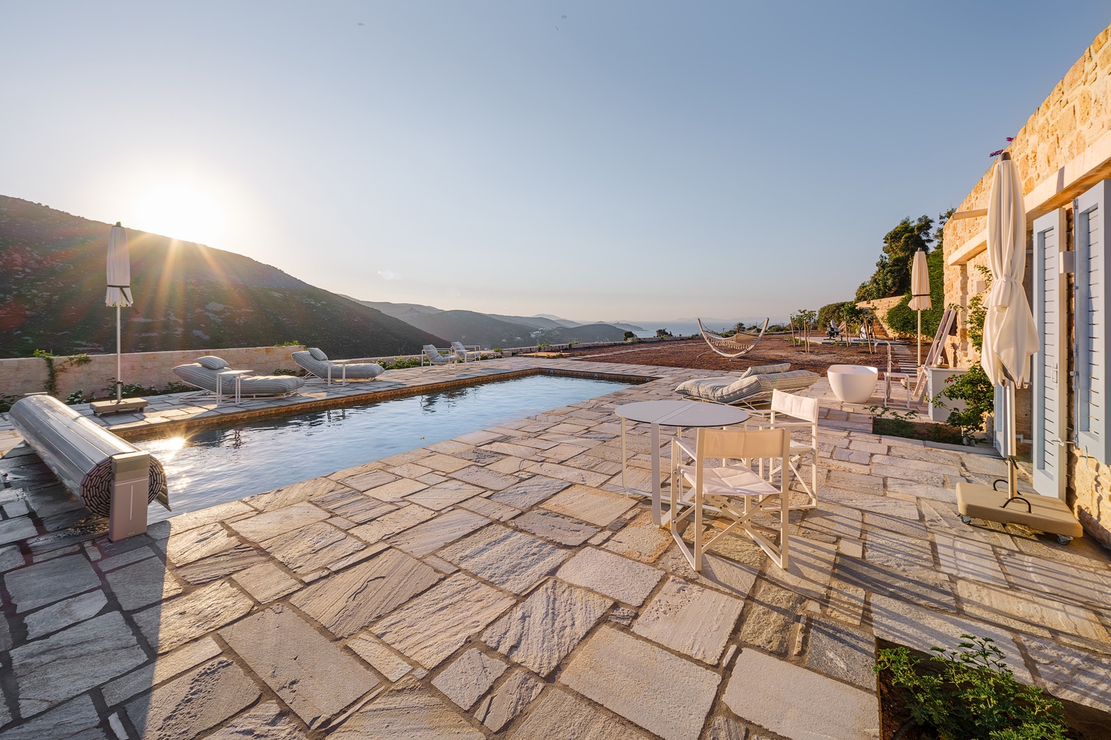 Elevated terrace with pool and stone walls at Patmos luxury villa