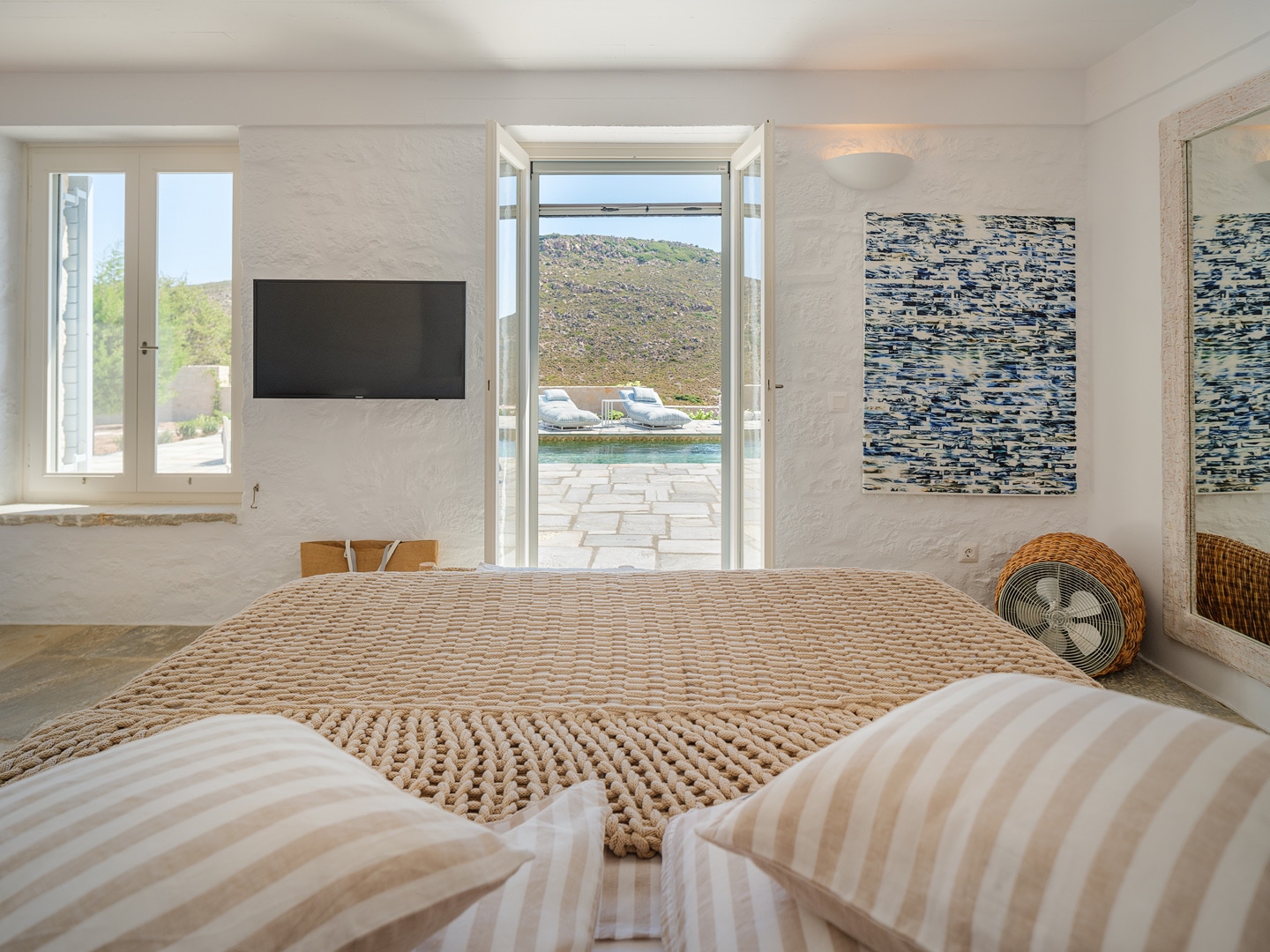 Bright bedroom interior with sea view at Patmos adults-only retreat