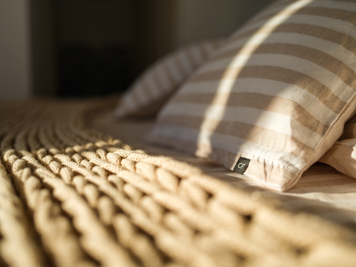 Cozy box-spring bed with soft linens at Patmos luxury retreat