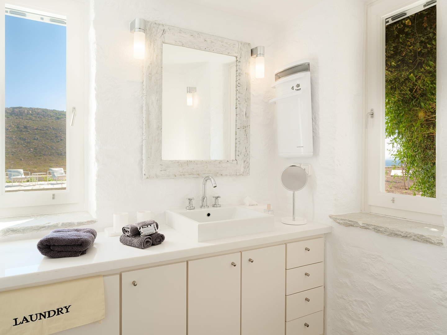 Modern bathroom with mirror and amenities at Patmos private villa studio