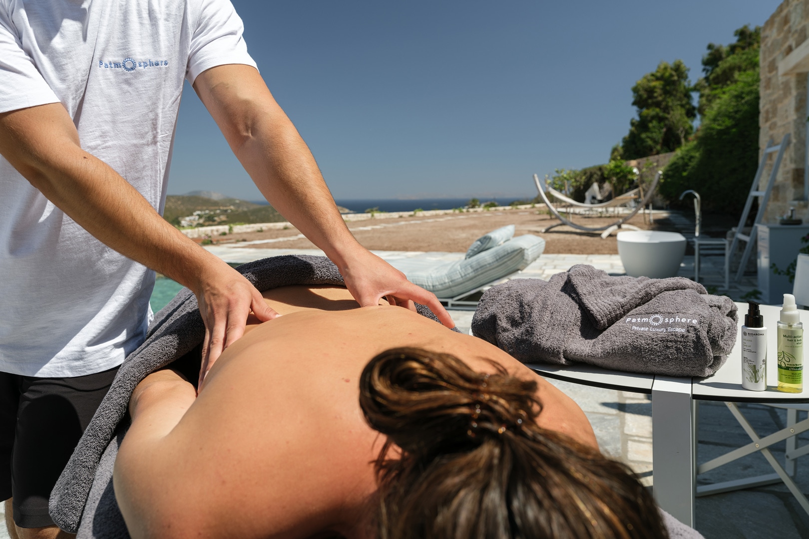 Guest enjoying relaxing massage by the sea at Patmos adults-only luxury escape