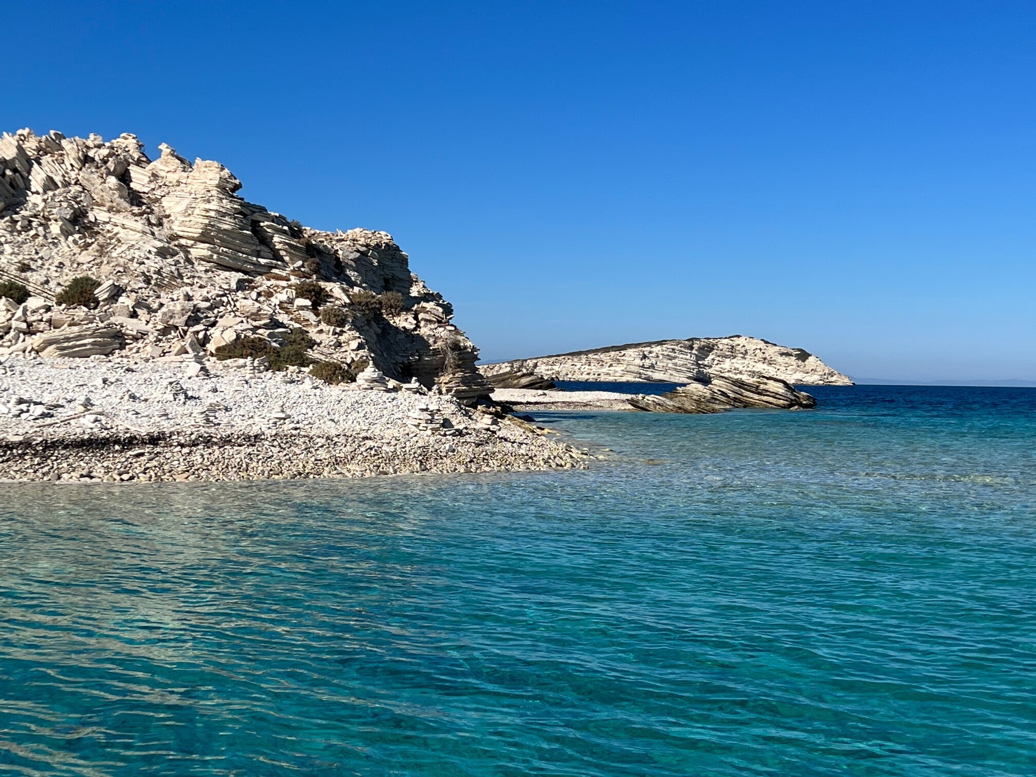 Crystal-clear turquoise sea and rocky coastline of Patmos island