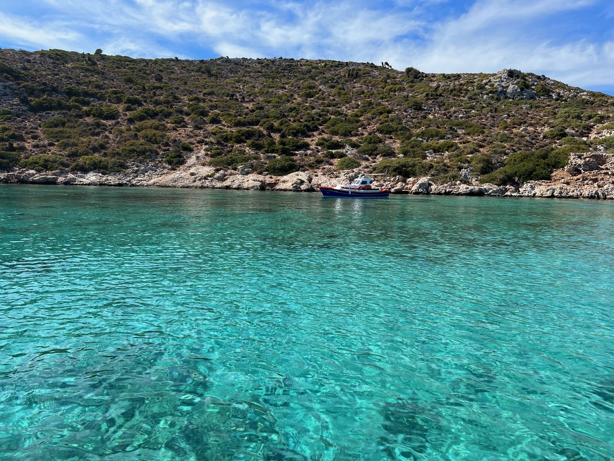 Natural rock arch formation with blue waters in Patmos Greece
