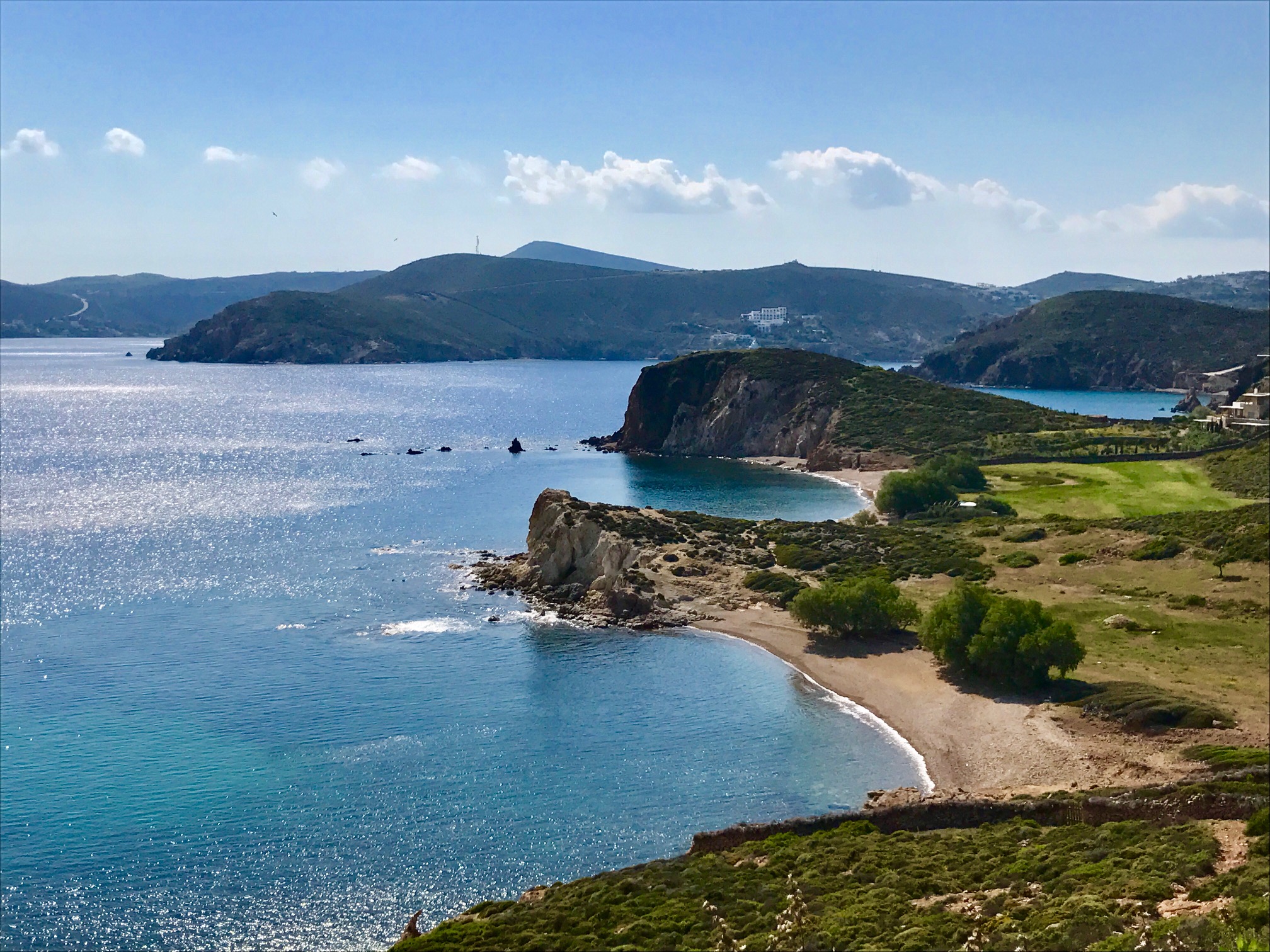 Panoramic view of Patmos coastline with secluded sandy coves and sparkling blue sea